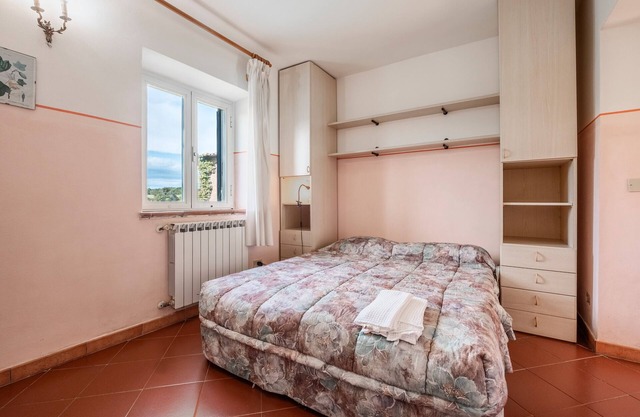 Apartamento 'Porcilaia' con piscina compartida, terraza privada y jardín compartido