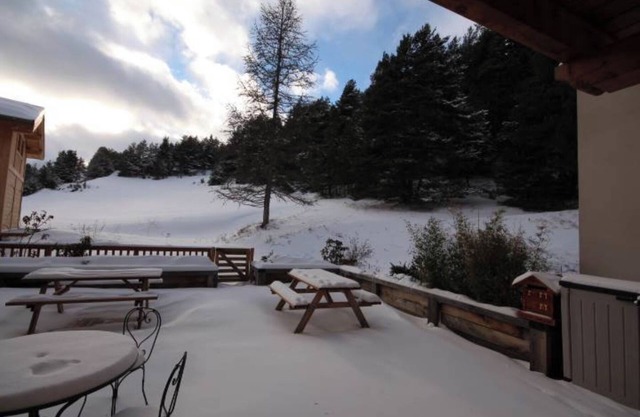 Apartamento 'Résidence Du Parc - 9 Personnes' con vistas a la montaña, jardín compartido y Wi-Fi