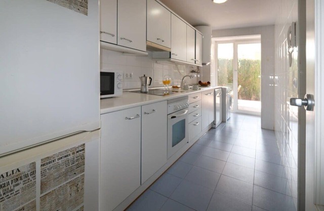 Apartment with private garden and common pools