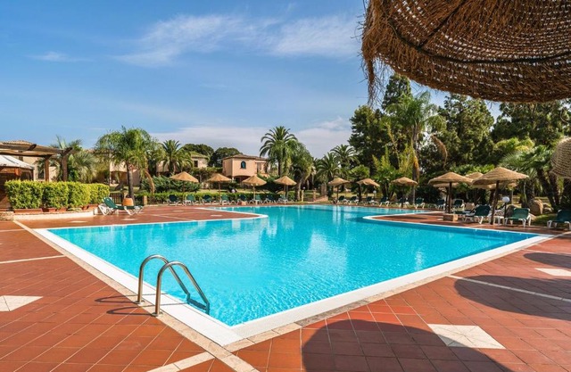 Apartments in residence with swimming pool in Santa Margherita di Pula, 250 meters from the sea