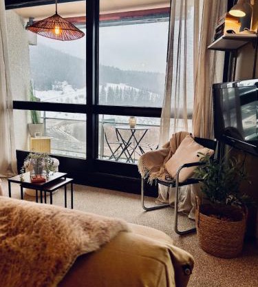 Appartement ensoleillé avec chambre vue montagne pied des pistes