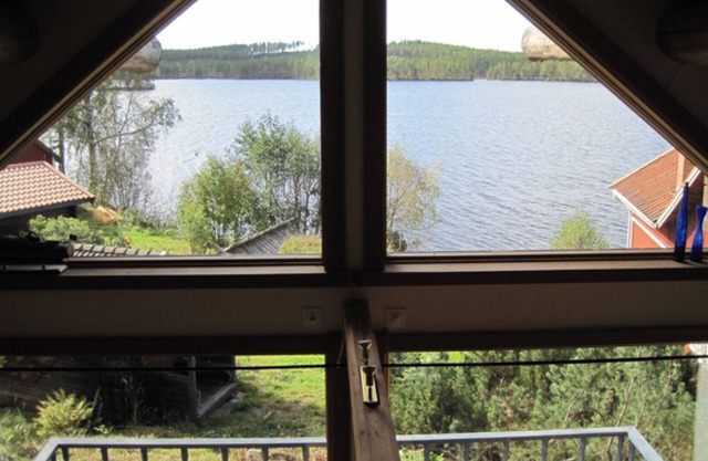 Attractive timber lodge near lake beach