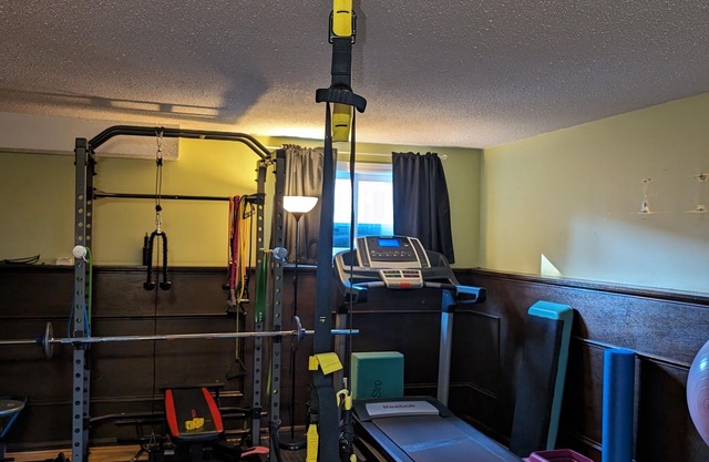 Backyard Oasis with Pool, Hot tub & Fire table. 4 bedrooms, gym, & a yoga area!