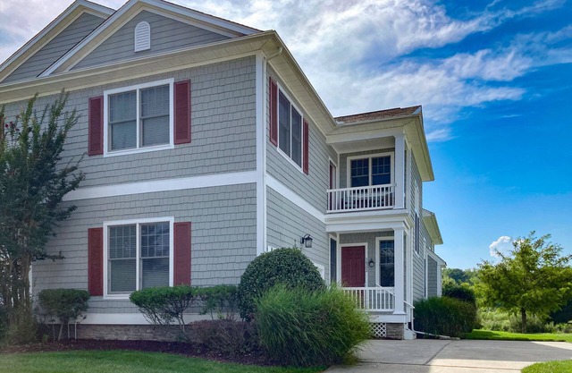 Bayside Resort home with an abundance of amenities, balcony, & updated interior