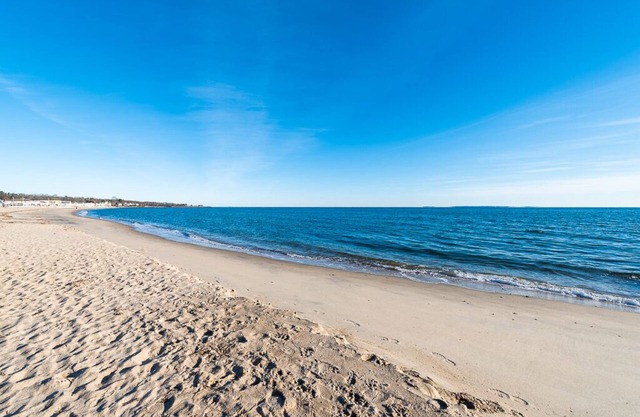Be Happy Beach House is a five minute walk from Hawk's Nest Beach!
