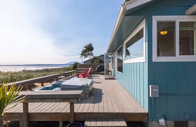 Beachfront house overlooking Dungeness Bay with hot tub