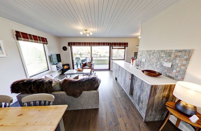 Hermoso chalet de 4 estrellas y 2 dormitorios con impresionantes vistas al lago y a la montaña
