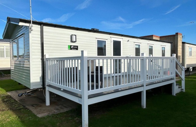 Beautiful 8 berth caravan with decking at Naze Marine Holiday Park ref 17344BR