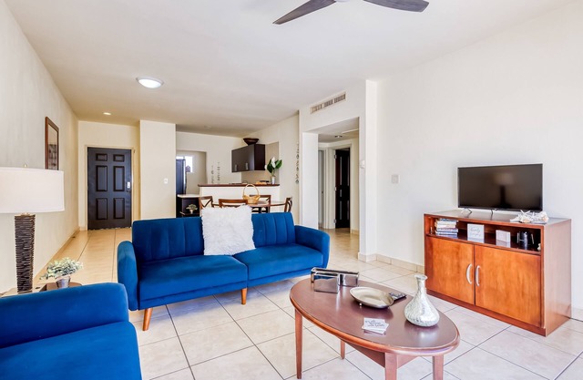 Beautiful condo with a balcony, kitchen, sparkling pools, & fitness center
