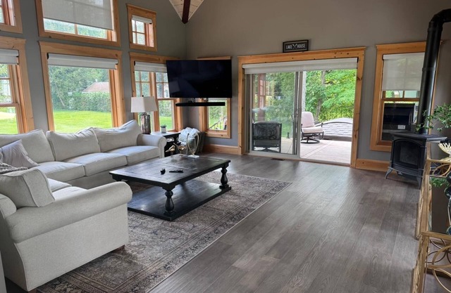 Beautiful Custom Log Home nestled on 300 ft beach front