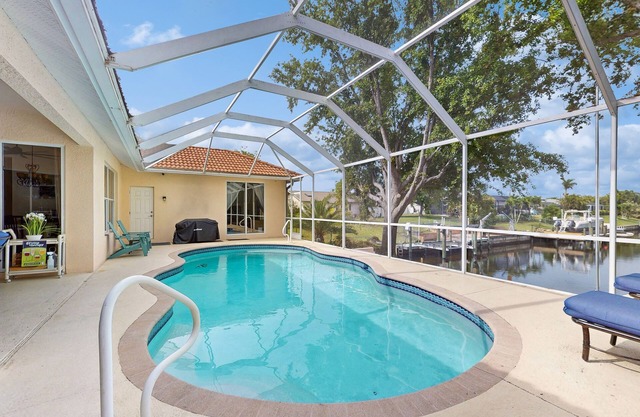 Beautiful home on the canal with pool & dock - Relax in paradise!