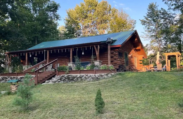 Beautiful Log Cabin 11ac. 4 br. 2.5 ba. on snowmobile trails in Manistee forest.