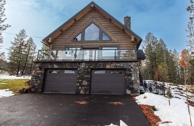 beautiful log home that is located on silver lake.