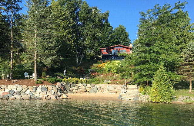 Beautiful sloping view to water's edge on this Lake Charlevoix South Arm escape.