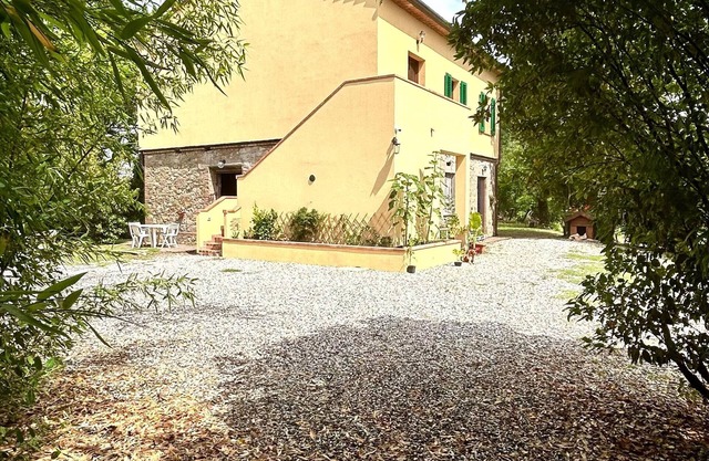 Beautiful Tuscan-style farmhouse surrounded by nature.
