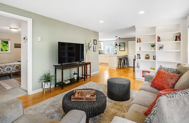 Beautifully updated home with enclosed yard, deck, WiFi, & W/D - near everything