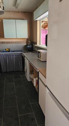 Bed and kitchen with pool