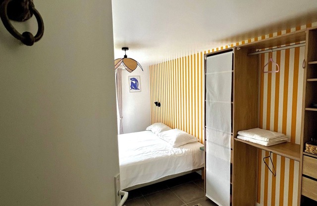 Bedroom with bathroom and garden in Maison Meulière