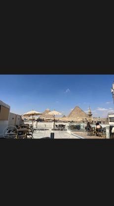 Behind BoutiQue Pyramids Hotel