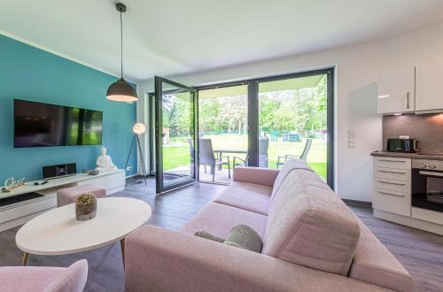 Bewusstsein - Modernes Apartment mit Terrasse, Walk-In-Dusche & Wellnesszugang