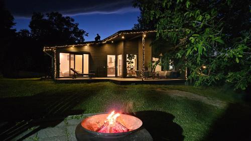 Black Walnut House with indoor outdoor fireplace