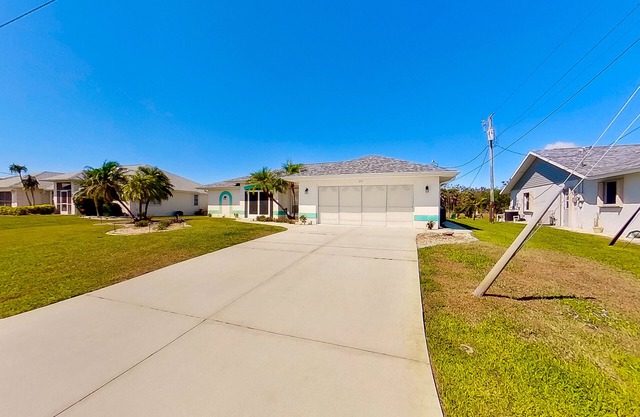 Bohemian canal-front retreat with pool, beach gear, adult bikes, & AC - dogs ok