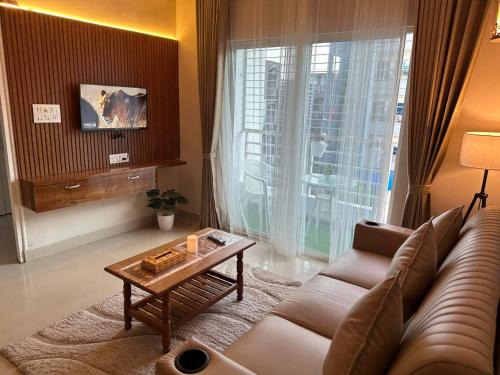 Boho Nest -Aesthetic 2BHK with Smart TV, Kitchen, Cozy Bedrooms & Peaceful Ambience