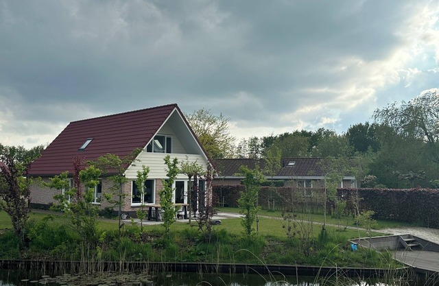 Brand new spacious home, with sunny garden flush with natural swimming water