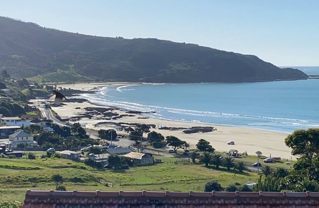 "Breakview" - quiet, comfortable bach with a spa pool, for families and surfers.
