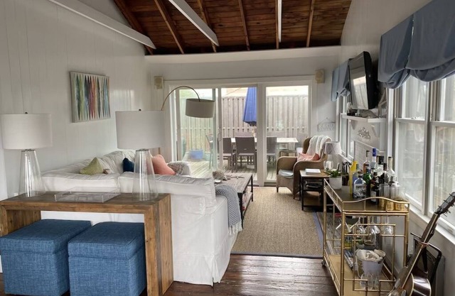 Bright airy Fair Harbor home with ocean views steps from the soft sandy beach