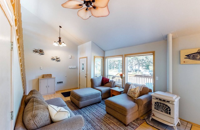 Bright dog-friendly home with wrap-around deck just steps from beach