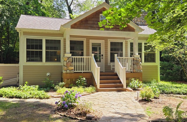 Bright Scandinavian-style cottage with large, private wooded yard