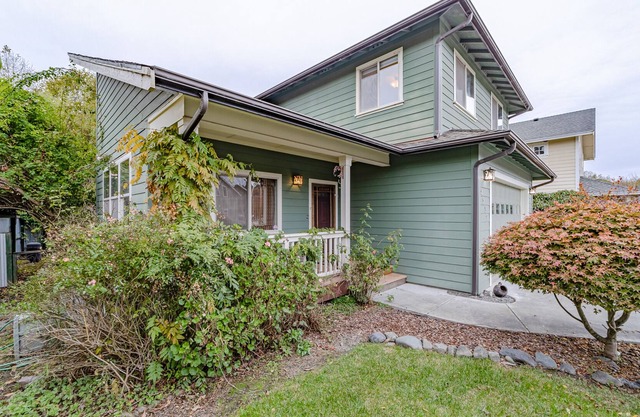 Bright, spacious home with park/trail access, deck, fireplace & great location