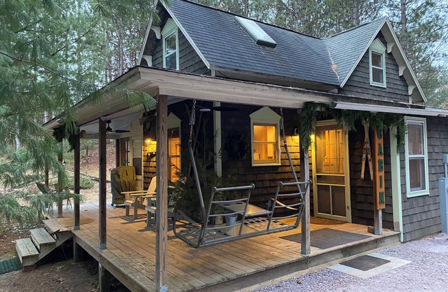 Cabin in the woods with wrap around porch