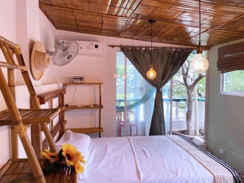 Cabin with balcony and ocean view.