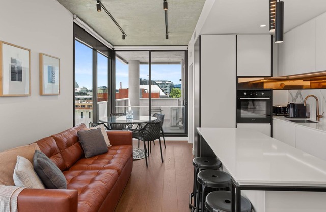Camillea - One-bedroom fifth-floor residence with MCG and city views.