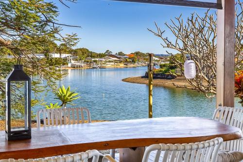 Canal Front family Home with extensive outdoor covered areas and pool