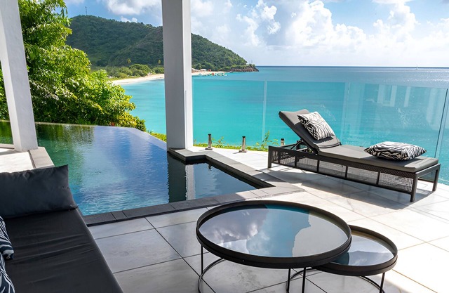 Caribbean Bliss Awaits in This Luxurious Beachside Villa with Dining Area