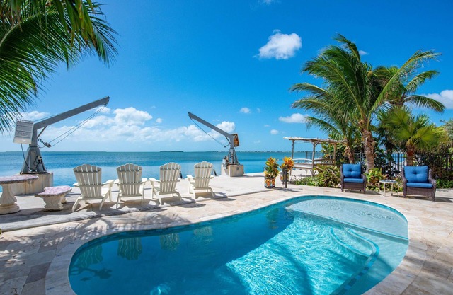 Caribbean Cabana: Your Perfect 3BR Oceanfront Retreat with Dockage, Pool and Breathtaking Views!