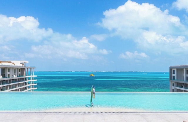 Caribbean Chic: 2 Bedroom Suite with Expansive Balcony & Resort Luxuries