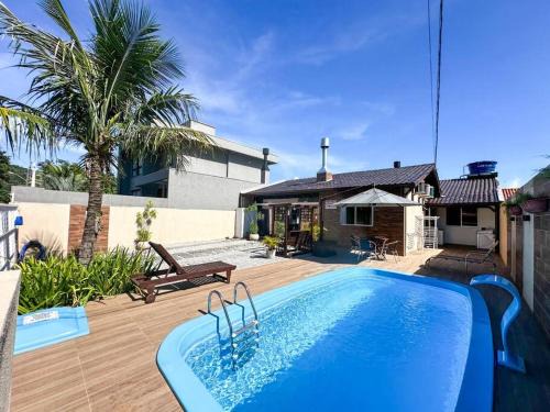 CASA GOLFINHO 348 - casa com piscina e lazer para até 8 pessoas