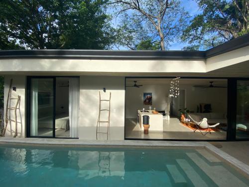 Casa Remy - Walk to the Beach and stay in a private compound! Pool, Kitchen, AC, Wi-Fi