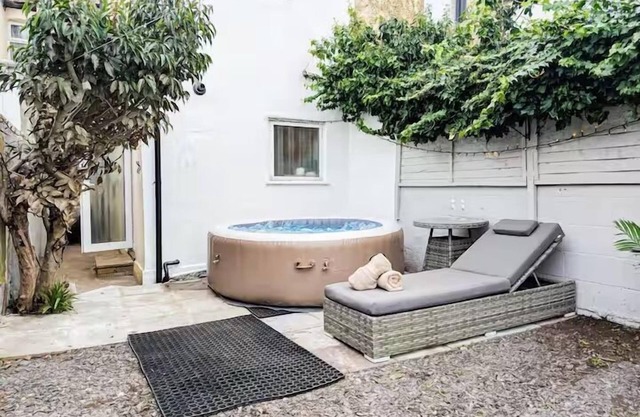 Central 3BR Home with Hot Tub Sleeps 10