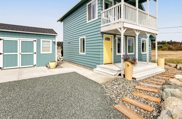 Centrally located home & loft near the beach with water views, fireplace & deck