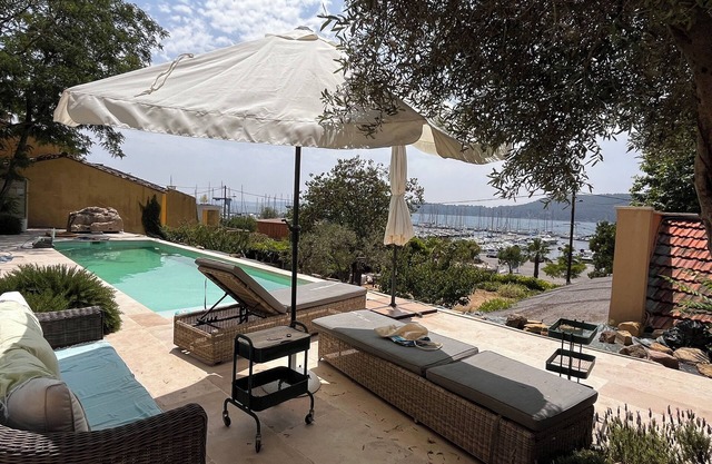 Character house with swimming pool on the small port of a Provencal village