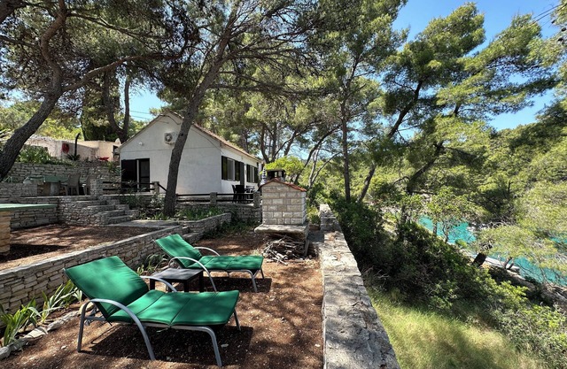 Charming 2-bedroom house in wonderful Rogač with AC situated 30 metres from sea.
