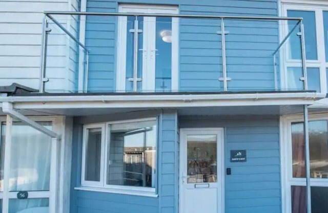 Charming Beach Chalet with Balcony & Sea Views