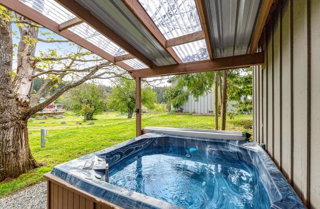 Charming & bright dog-friendly cabin with nature views, hot tub, and fireplace