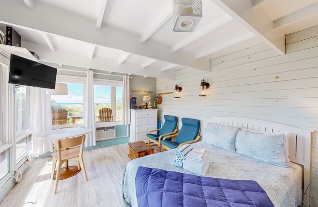 Charming coastal studio with private beach access, scenic patio, grill, & games