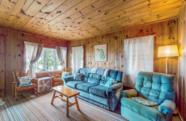 Charming lakefront cottage with large yard, dock, & fire pit - close to downtown